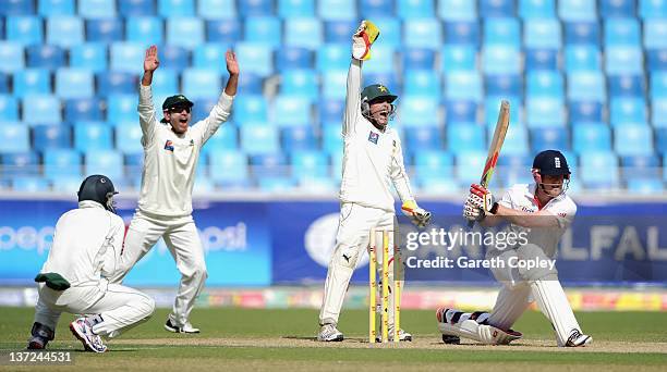 Pakistan wicketkeeper Adnan Akmal and Mohammad Hafeez successfully appeal for the wicket of Eoin Morgan of England during the first Test match...