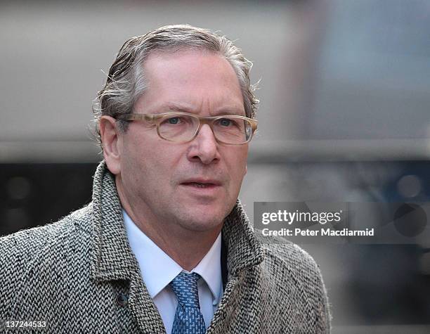 John Witherow, editor of The Sunday Times, arrives at The High Court to give evidence to the Leveson Inquiry on January 17, 2012 in London, England....