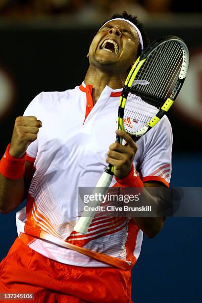 Jo-Wilfried Tsonga of France celebrates after winning his first round match against Denis Istomin of Uzbekistan during day two of the 2012 Australian...