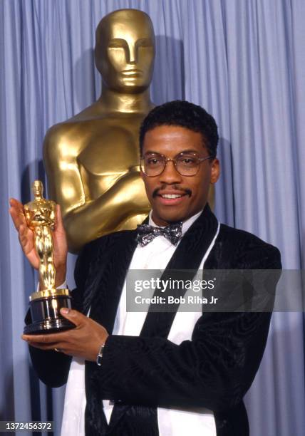 Herbie Hancock celebrates with his Oscar Award for Best Original Score for 'Round Midnight' backstage at the Academy Awards Show, March 30,1987 in...