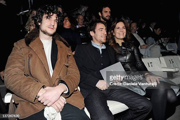 Louis Garrel, Elio Germano and Roberta Armani attend the Giorgio Armani fashion show as part of Milan Fashion Week Menswear Autumn/Winter 2012 on...