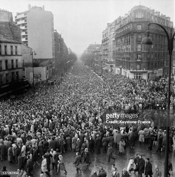 Thousands of people are at the funeral of 8 people killed during anti Algerian war demonstration at Charonne subway station on February 13, 1962 in...