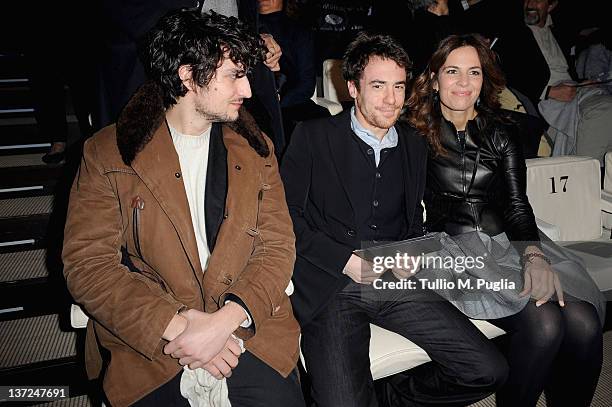 Louis Garrel, Elio Germano and Roberta Armani attend the Giorgio Armani fashion show as part of Milan Fashion Week Menswear Autumn/Winter 2012 on...