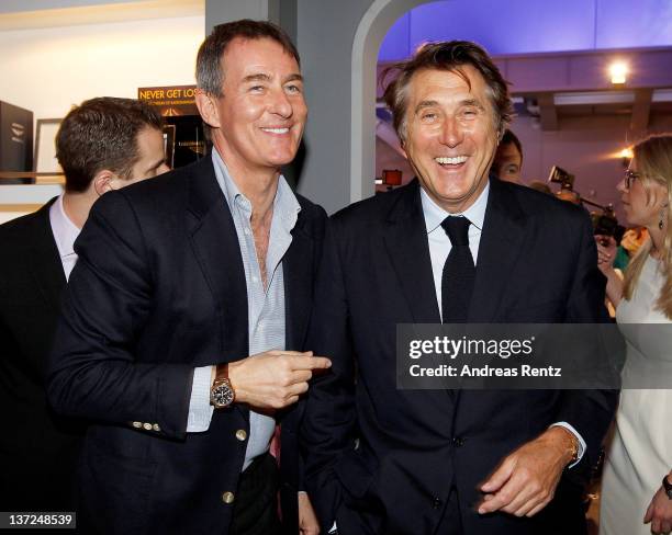Gallery owner Tim Jefferies and musician Bryan Ferry visit the IWC Schaffhausen booth during the 22nd SIHH High Jewellery Fair at the Palexpo...