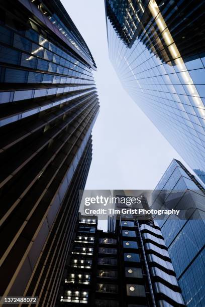 directly below shot of modern skyscrapers in the city of london - corporate headquarters stock pictures, royalty-free photos & images