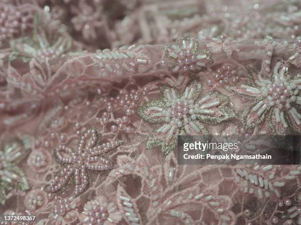 pearl mesh dress pink flower embroidery lace fabric fashion, sequin fabric fashion, string the beads - lace textile stock pictures, royalty-free photos & images