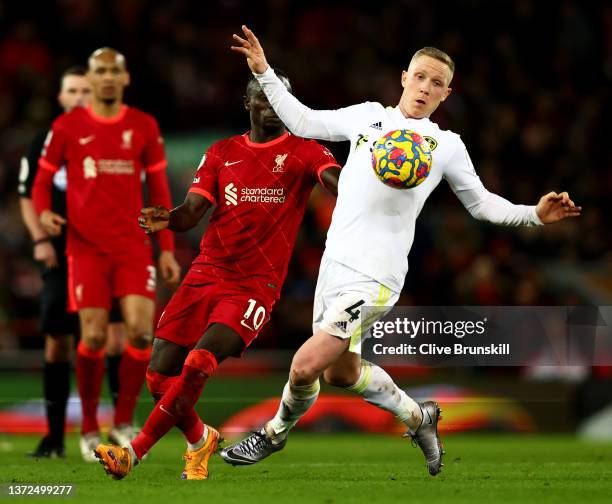 Adam Forshaw of Leeds United in action with Sadio Mane of Liverpool during the Premier League match between Liverpool and Leeds United at Anfield on...