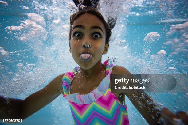 cheeky childhood - kids swimming stock pictures, royalty-free photos & images