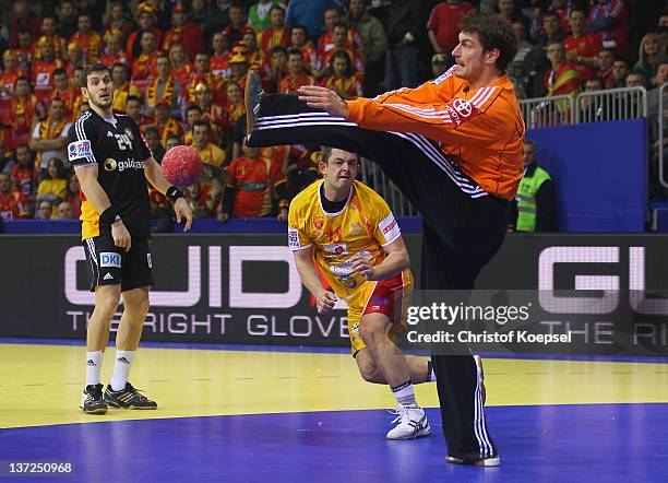 Carsten Lichtlein of Germany saves a ball against Naumche Mojsovski of Macedonia during the Men's European Handball Championship group B match...