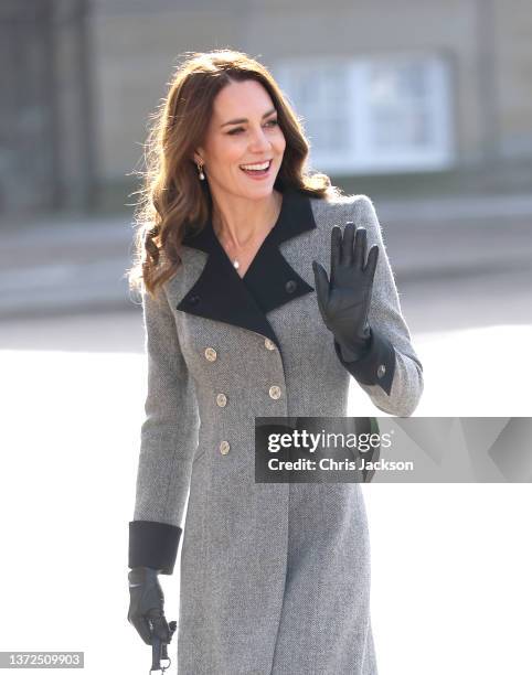 Catherine, Duchess of Cambridge waves as she accompanies Mary, Crown Princess of Denmark during a visit Christian IX's Palace on February 23, 2022 in...