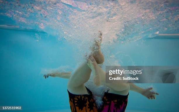 creating cannonballs - cannonball diving stock pictures, royalty-free photos & images