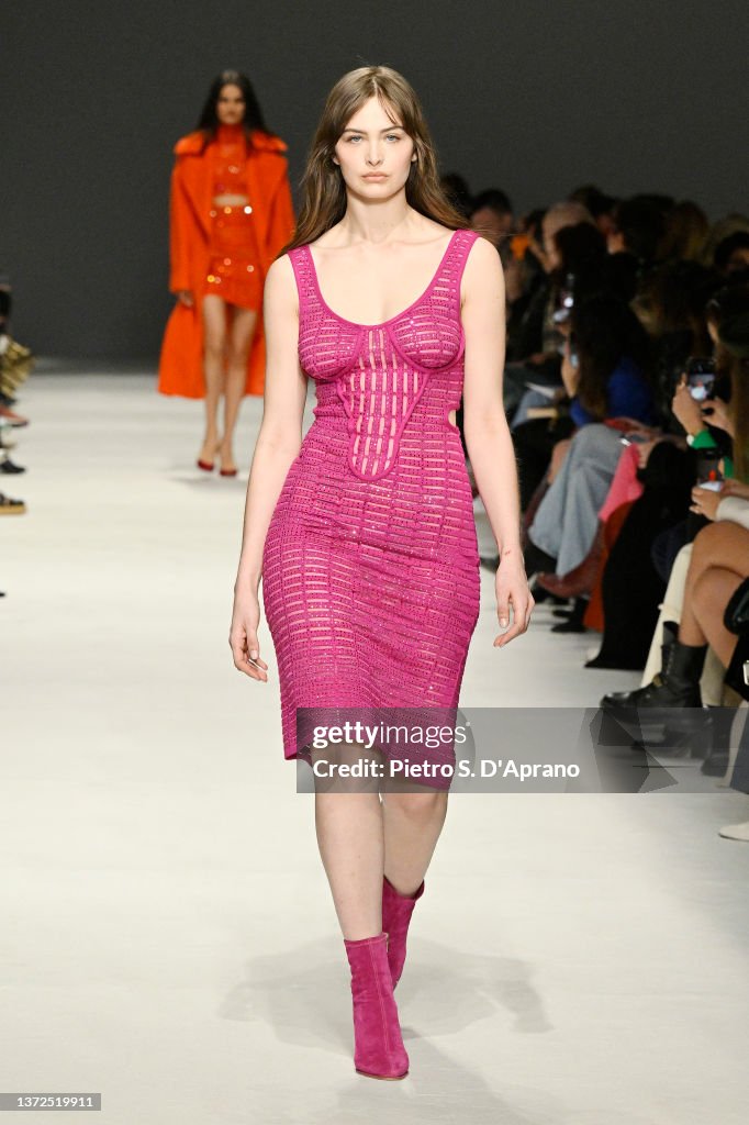 Genny Model A model walks the runway at the Genny fashion show during the Milan ...