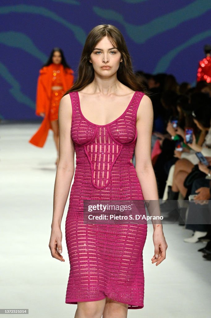 Genny Model A model walks the runway at the Genny fashion show during the Milan ...