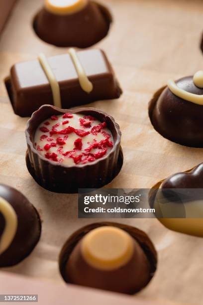 gourmet chocolates selection macro close up - milk chocolate truffles stock pictures, royalty-free photos & images