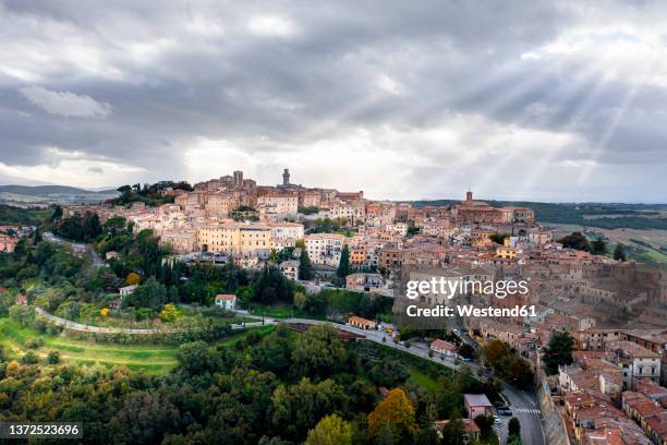 italy, province of siena, montepulciano, helicopter view of medieval hill town in val dorcia - montepulciano stock pictures, royalty-free photos & images