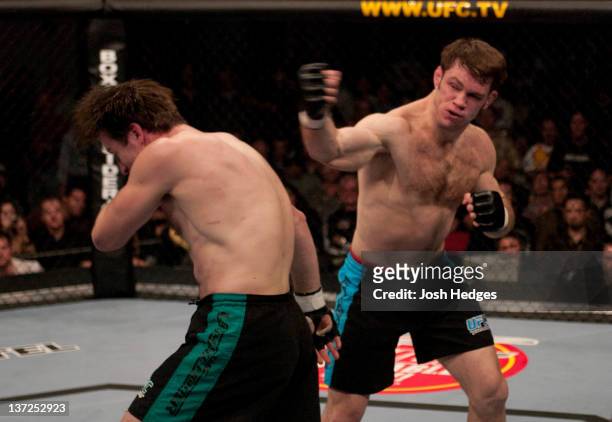 Forrest Griffin punches Stephan Bonnar during the Light Heavyweight Final bout during the live Ultimate Fighter Season Finale at the Cox Pavilion on...