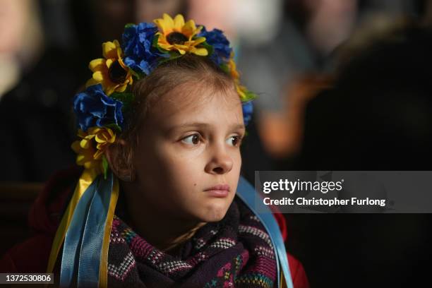Children wear crowns made from flowers as members of the Manchester Ukrainian community attend morning mass at St Mary's Ukrainian Catholic Church...