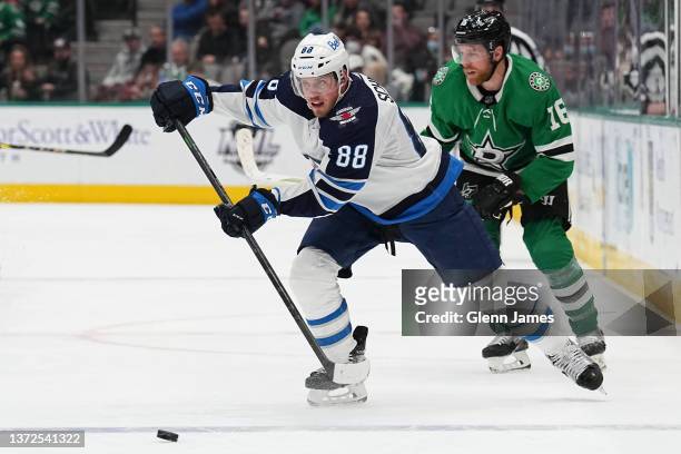 Nate Schmidt of the Winnipeg Jets handles the puck against the Dallas Stars at the American Airlines Center on February 23, 2022 in Dallas, Texas.