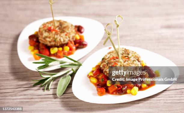 mini rice burgers on a spicy sauce - kidney bean stock pictures, royalty-free photos & images