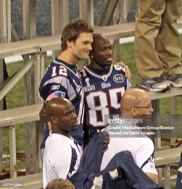 New England Patriots quarterback Tom Brady poses with New England Patriots wide receiver Chad Ochocinco as the Patriots pose for photos on the field...