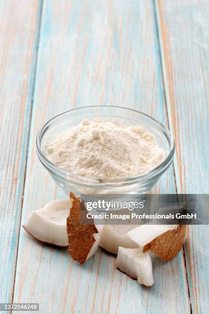 coconut flour and chunks of coconut - coconut chunks stock pictures, royalty-free photos & images