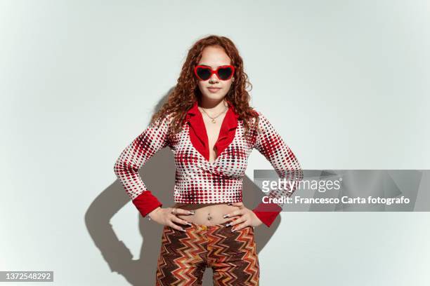 young woman with eccentric clothing - kuriose mode stock-fotos und bilder