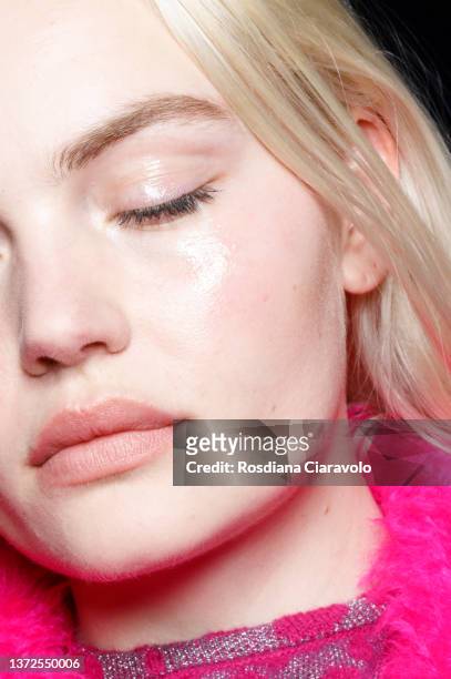 Model, make up detail, poses backstage of the Genny fashion show during the Milan Fashion Week Fall/Winter 2022/2023 on February 24, 2022 in Milan,...