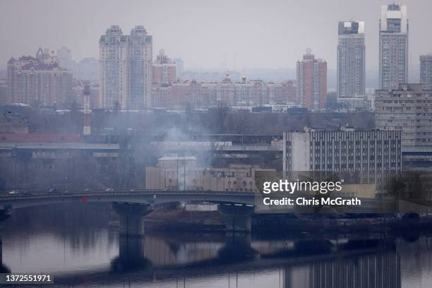 Smoke rises from outside an intelligence building on February 24, 2022 in Kyiv, Ukraine. Overnight, Russia began a large-scale attack on Ukraine,...