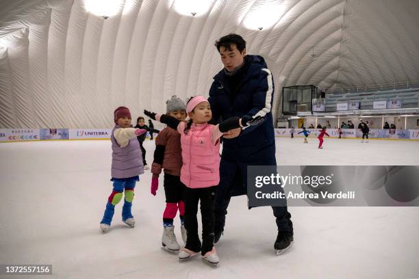 Young girls train for figure skating under the supervision of an instructor on February 24, 2022 in Beijing, China. China finished the Beijing 2022...