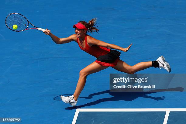 Olivia Rogowska of Belgium plays a forehand in her second round match against Li Na of China during day three of the 2012 Australian Open at...