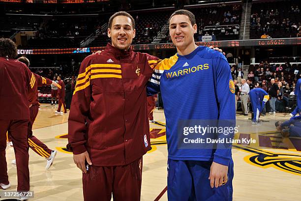 Mychel Thompson of the Cleveland Cavaliers stands alongside his brother Klay Thompson of the Golden State Warriors at The Quicken Loans Arena on...