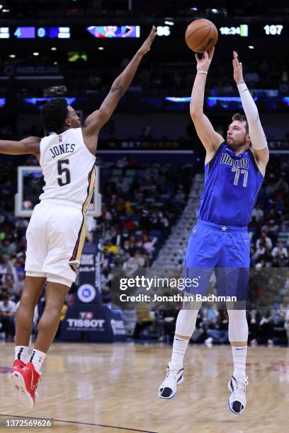 Luka Doncic of the Dallas Mavericks shoots over Herbert Jones of the New Orleans Pelicans during a game at the Smoothie King Center on February 17,...