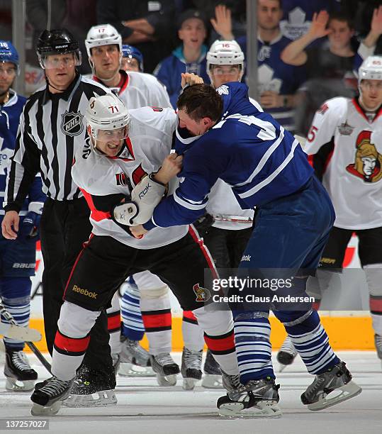 Dion Phaneuf of the Toronto Maple Leafs fights Nick Foligno of the Ottawa Senators in a game on January 17, 2012 at the Air Canada Centre in Toronto,...