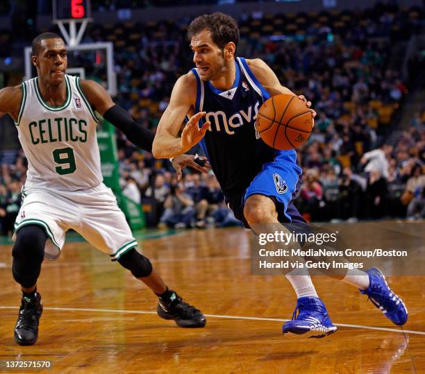 Dallas Mavericks point guard Jose Calderon drives past Boston Celtics point guard Rajon Rondo in the 4th quarter as the Boston Celtics take on the...