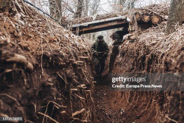 Ukrainian army soldier walks through a trench on the Niu York frontline, February 22 Niu York, Donetsk Oblast, Ukraine. Russia yesterday recognized...