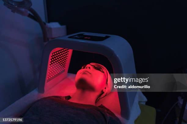 young patient having treatment with led light - led light stock pictures, royalty-free photos & images