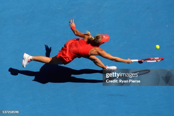 Caroline Wozniacki of Denmark plays a forehand in her second round match against Anna Tatishvili of Georgia during day three of the 2012 Australian...