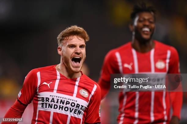 Yorbe Vertessen of PSV Eindhoven celebrates their sides first goal during the UEFA Europa Conference League Knockout Round Play-Offs Leg Two match...
