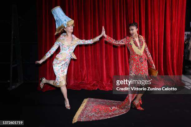 Jan Baiboon and a model pose backstage of the Moschino fashion show during the Milan Fashion Week Fall/Winter 2022/2023 on February 24, 2022 in...