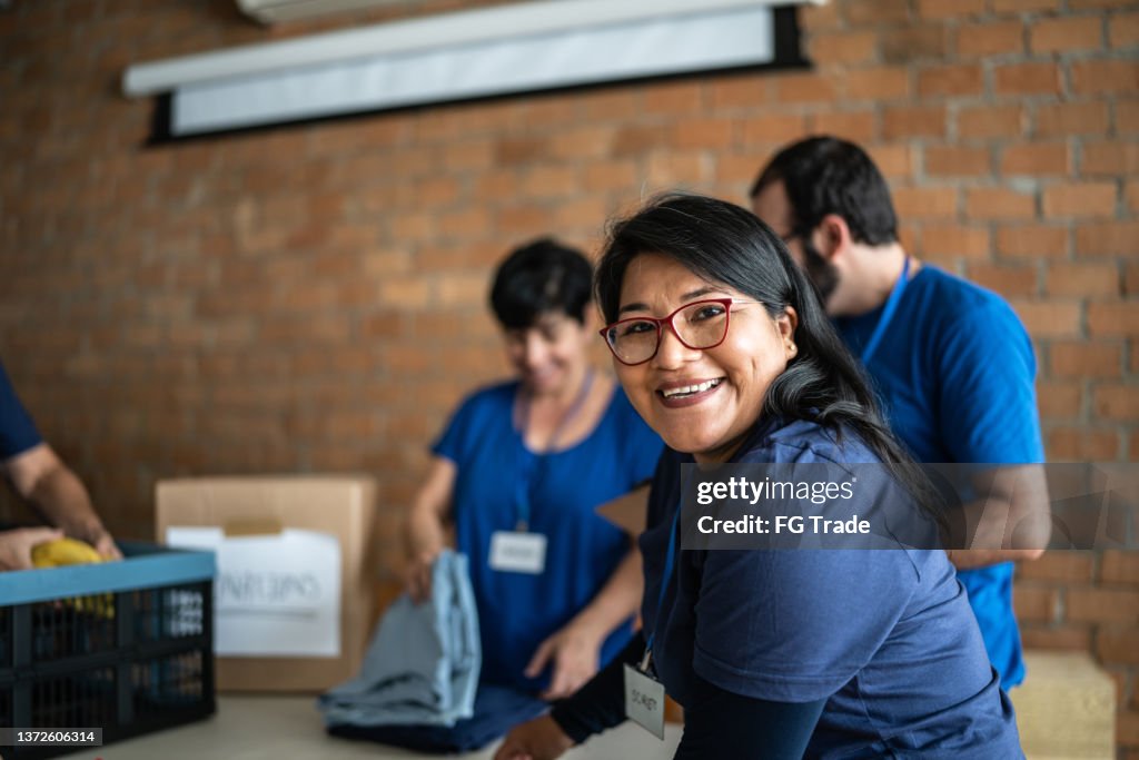 Portrait of a volunteer working in a community charity donation center