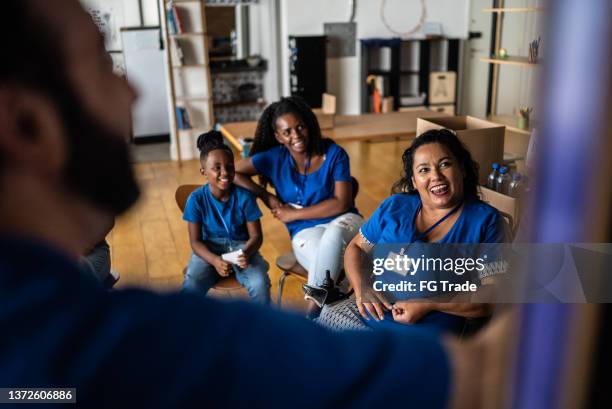 people in a meeting at a community center - including a disabled person - community center stock pictures, royalty-free photos & images