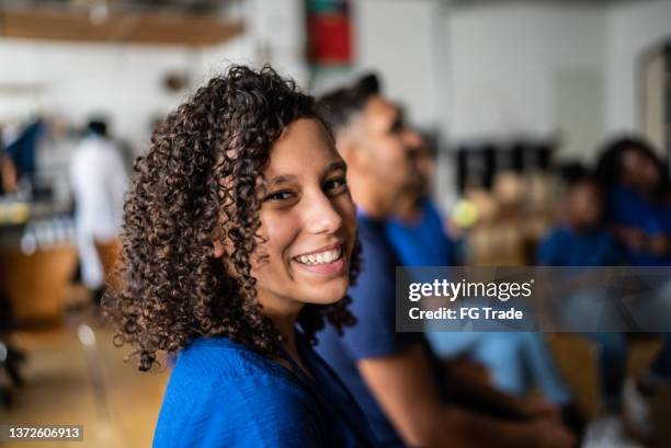 portrait of a teenage girl in a meeting at a community center - brazil girls supporters stock pictures, royalty-free photos & images