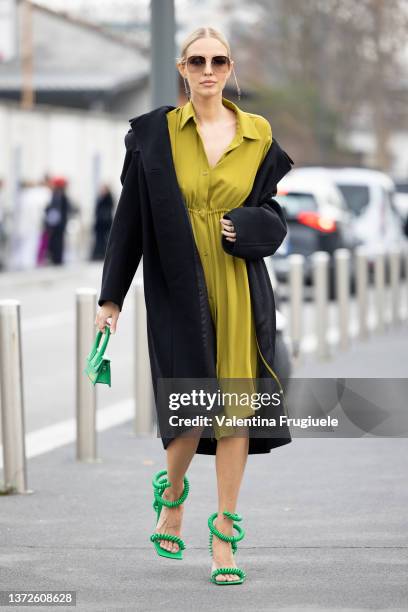 Leonie Hanne is seen ahead of the MM6 Maison Margiela fashion show wearing a dress jacquemus mini bag and green telephone cord shoes during the Milan...