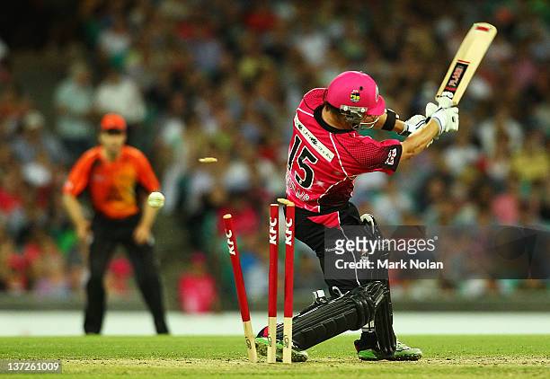 Nathan McCullum of the Sixers is bowled by Ben Edmondson of the Scorchers during the T20 Big Bash League match between the Sydney Sixers and the...