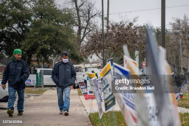 People walk to cast their ballot at the Moody Community Center on February 24, 2022 in Houston, Texas. People across the Houston metropolitan area...