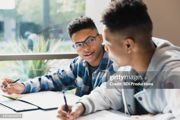 male high school friends studying together - boy talking stock pictures, royalty-free photos & images