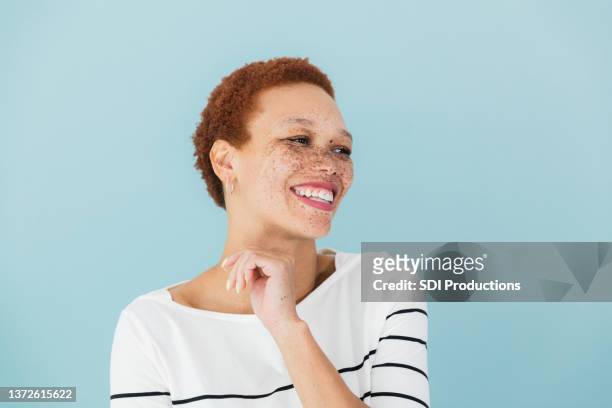 candid photo headshot - woman blue background stock pictures, royalty-free photos & images