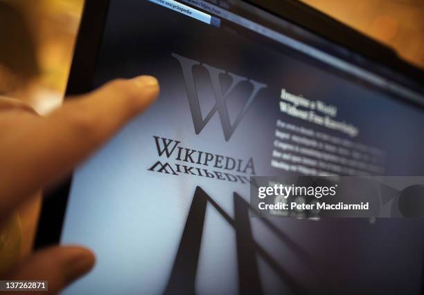 Laptop computer displays Wikipedia's front page showing a darkened logo on January 18, 2012 in London, England. The Wikipedia website has shut down...