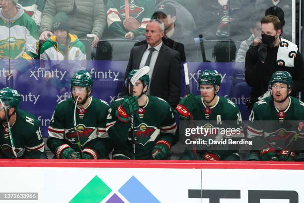Head coach Dean Evason of the Minnesota Wild looks on from the bench in the third period of the game against the Detroit Red Wings at Xcel Energy...