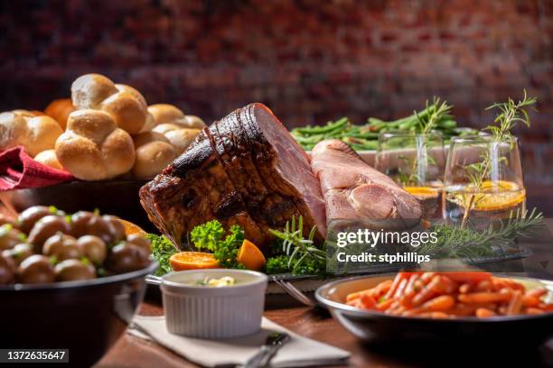 glazed spiral cut easter ham dinner - easter dinner stock pictures, royalty-free photos & images